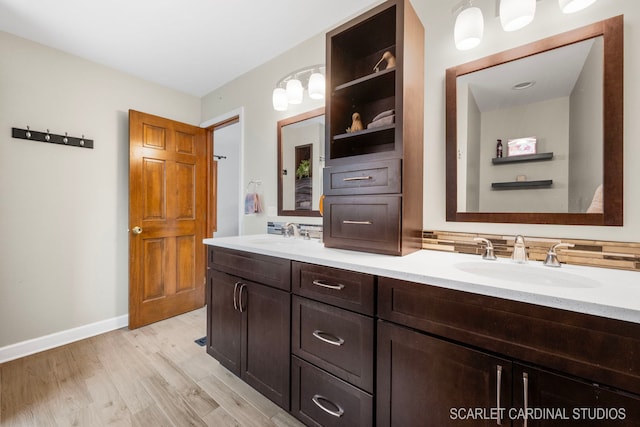 bathroom with vanity and wood-type flooring