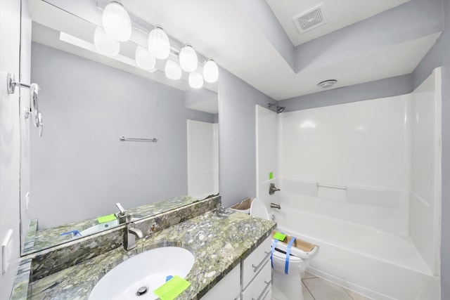 full bathroom featuring vanity, tile patterned flooring, toilet, and shower / bathtub combination