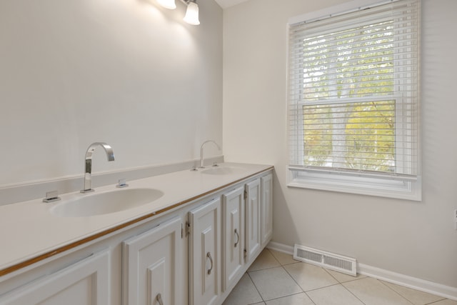 bathroom featuring vanity, plenty of natural light, and tile patterned flooring