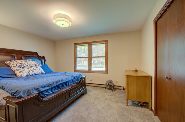 carpeted bedroom featuring a baseboard heating unit