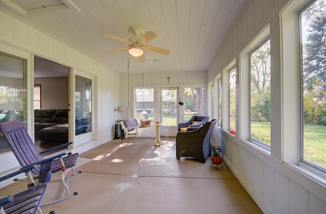 sunroom featuring a healthy amount of sunlight and ceiling fan