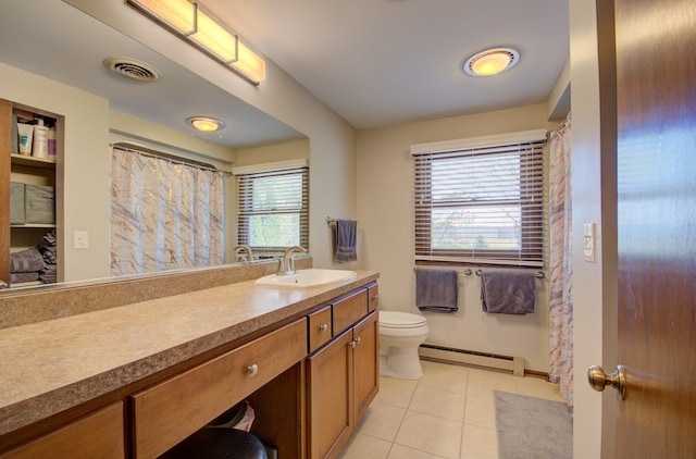 bathroom with vanity, a baseboard radiator, toilet, and plenty of natural light