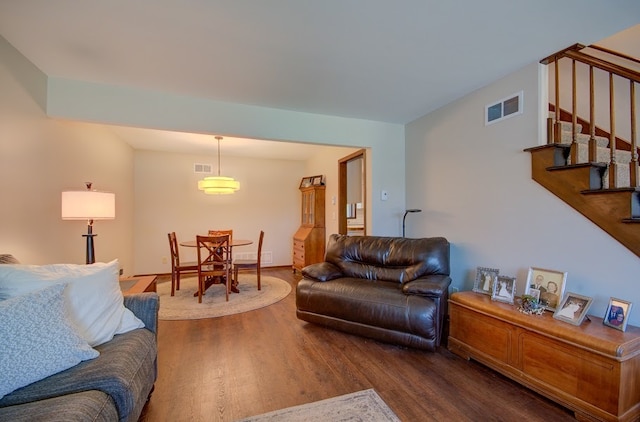 living room featuring dark hardwood / wood-style flooring