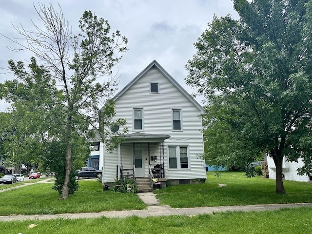 1019 E Bourbonnais St, Kankakee, IL 60901 - view of front facade with a front yard and a porch