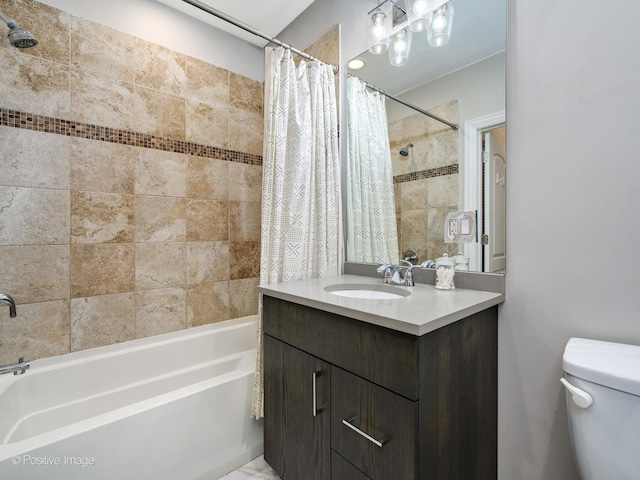 full bathroom featuring vanity, toilet, and shower / tub combo