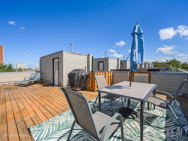 wooden terrace featuring area for grilling