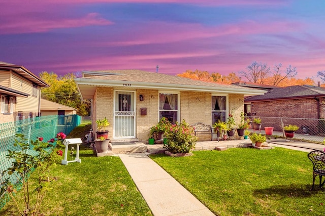 view of front of home featuring a yard