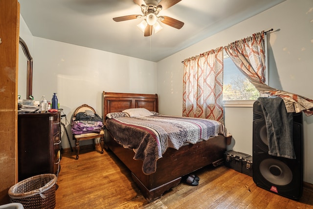 bedroom with light wood-type flooring and ceiling fan