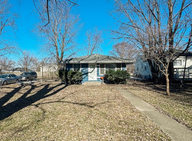 ranch-style home with a front lawn