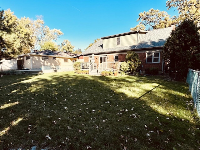 back of house with a yard