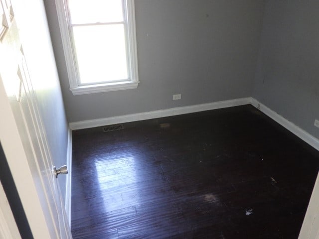 empty room featuring dark hardwood / wood-style floors