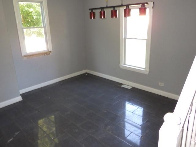 7732 S Muskegon Ave, Chicago, IL 60649 - empty room featuring baseboards