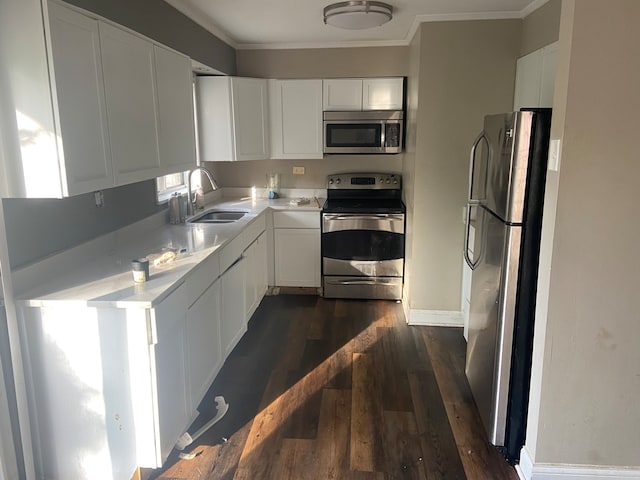 kitchen featuring white cabinets, dark hardwood / wood-style floors, sink, and appliances with stainless steel finishes