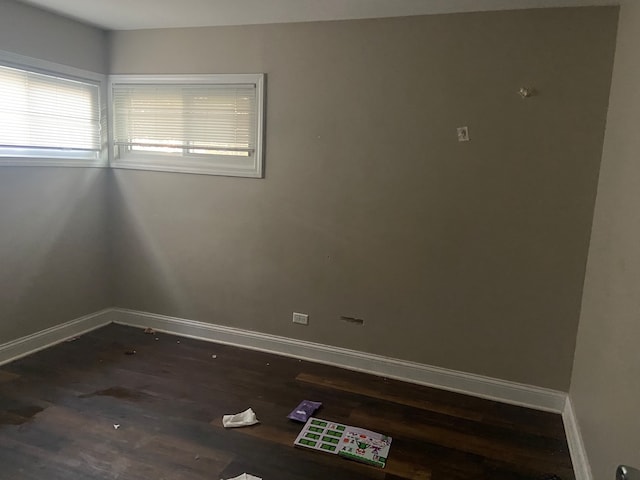 empty room featuring dark hardwood / wood-style flooring