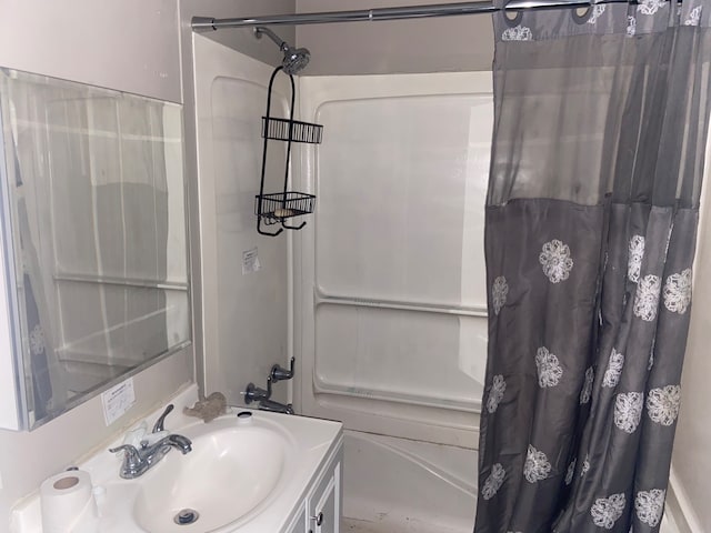 bathroom featuring vanity and shower / bath combination with curtain