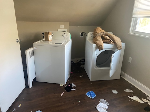 clothes washing area featuring washing machine and dryer and dark hardwood / wood-style flooring