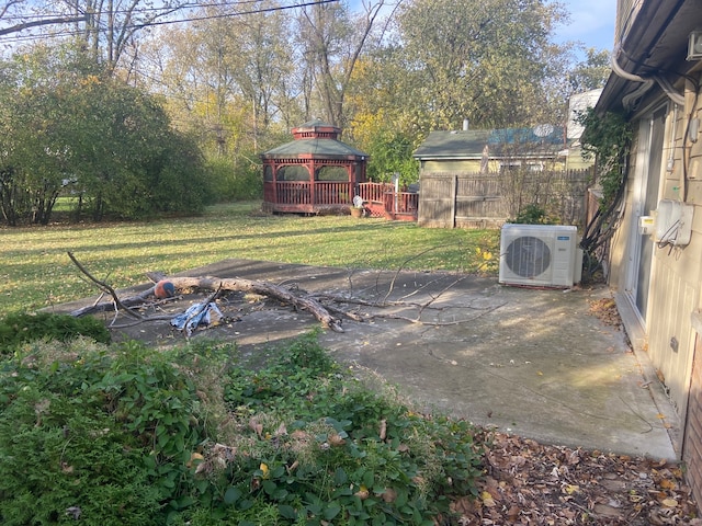 view of yard with a gazebo, ac unit, and a patio area