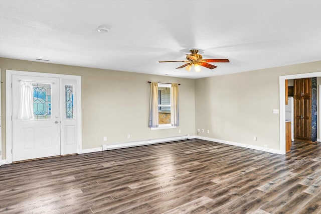 foyer entrance with ceiling fan, plenty of natural light, dark hardwood / wood-style flooring, and a baseboard heating unit