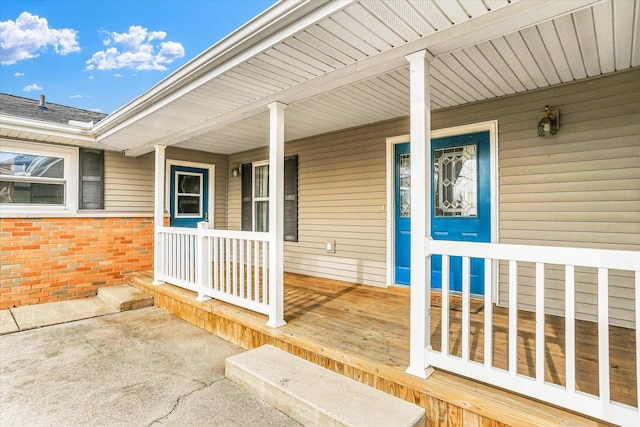 entrance to property featuring covered porch