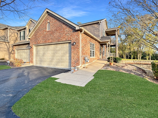 view of side of home with a garage and a lawn