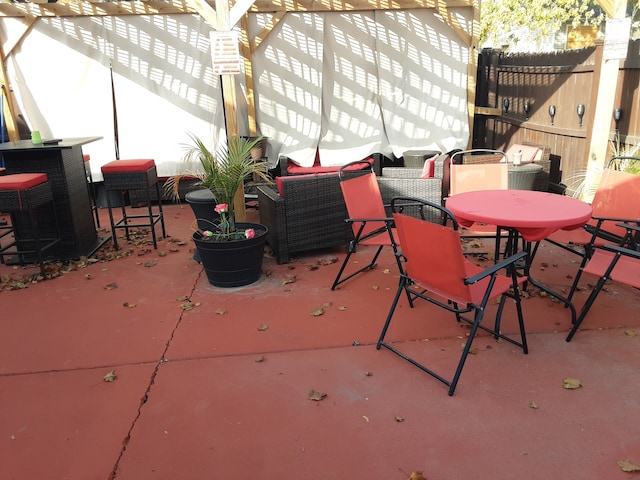 view of patio with central AC and outdoor lounge area