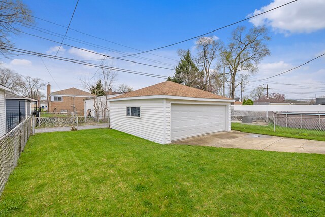 garage with a lawn