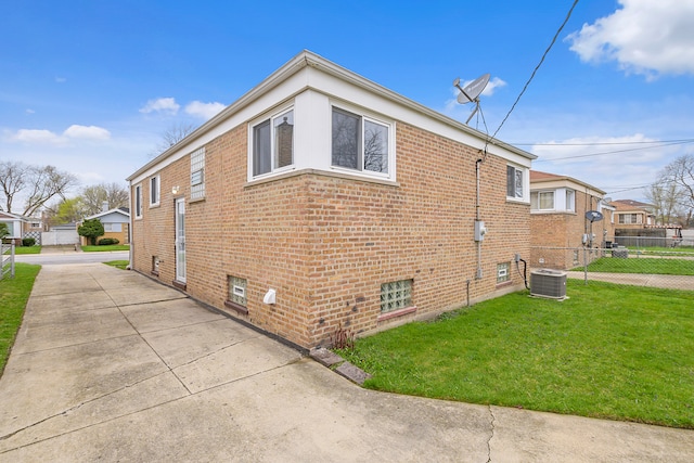 view of property exterior with a lawn