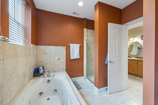 bathroom with independent shower and bath, tile patterned flooring, and vanity