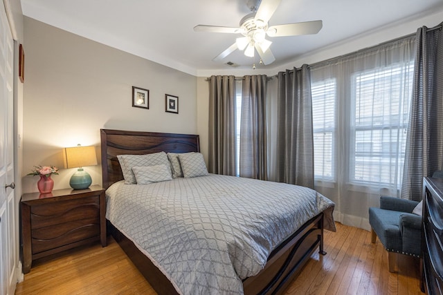 bedroom featuring hardwood / wood-style floors and ceiling fan