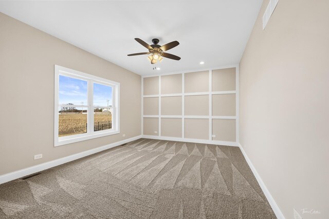 unfurnished room featuring carpet and ceiling fan