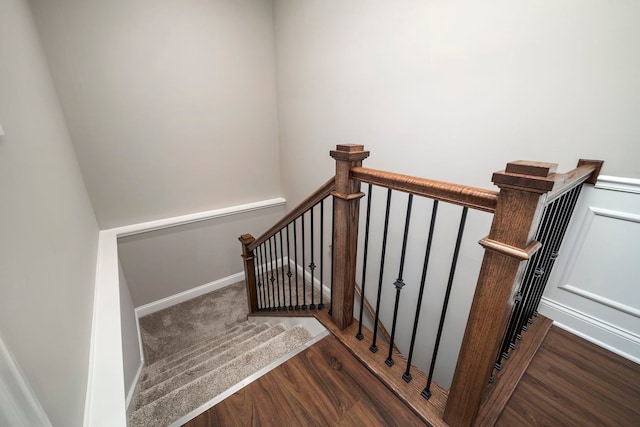 staircase with wood-type flooring