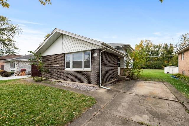 view of property exterior with a yard and a storage unit