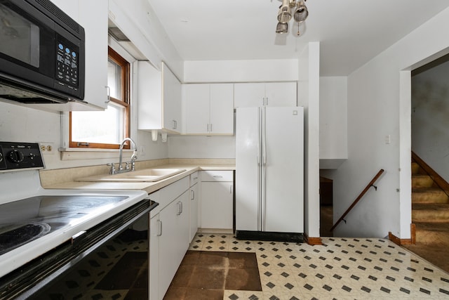 kitchen with sink, white cabinets, and white appliances