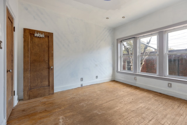 spare room featuring light wood-type flooring