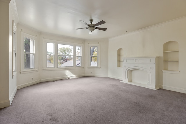 unfurnished living room with crown molding, built in shelves, and plenty of natural light