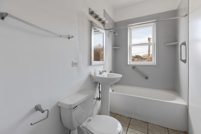 bathroom featuring toilet, tile patterned flooring, and shower / bathtub combination