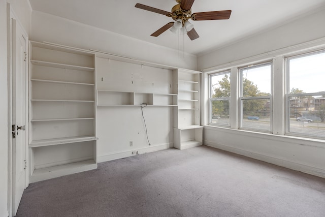 interior space with ceiling fan and carpet flooring