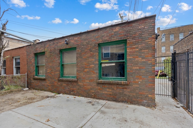 view of side of property with a patio