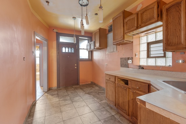 kitchen with pendant lighting and light tile patterned floors