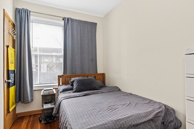 bedroom featuring dark hardwood / wood-style flooring