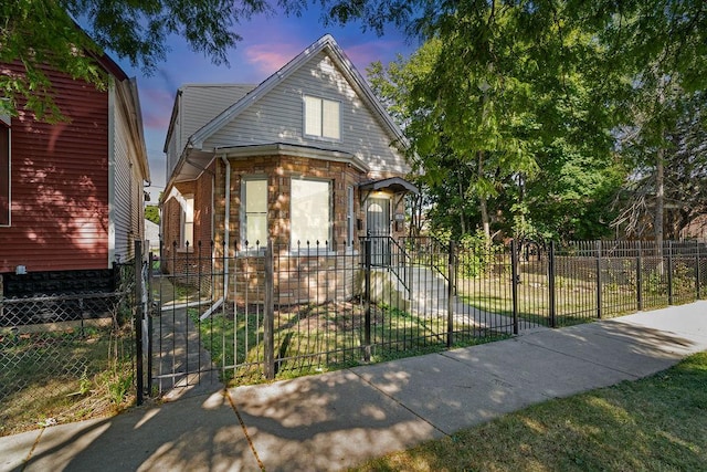 9208 S Dobson Ave, Chicago, IL 60619 - bungalow-style house featuring a gate, brick siding, and a fenced front yard