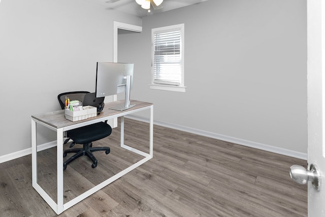 office with wood-type flooring and ceiling fan