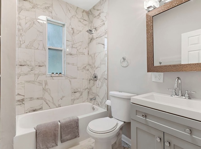 full bathroom featuring vanity, tiled shower / bath combo, and toilet