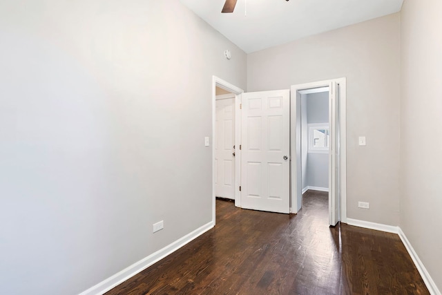 9208 S Dobson Ave, Chicago, IL 60619 - unfurnished bedroom with baseboards, a ceiling fan, and dark wood-style floors