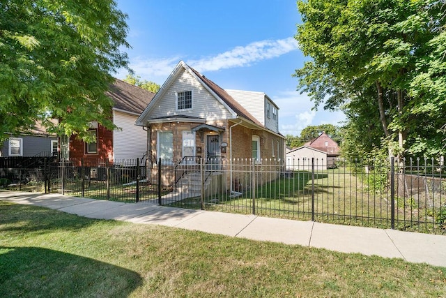 9208 S Dobson Ave, Chicago, IL 60619 - view of front facade with a front yard, brick siding, and a fenced front yard