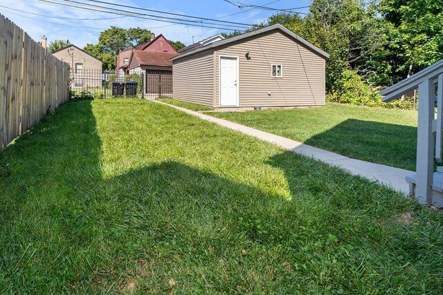 9208 S Dobson Ave, Chicago, IL 60619 - view of yard featuring an outbuilding and fence