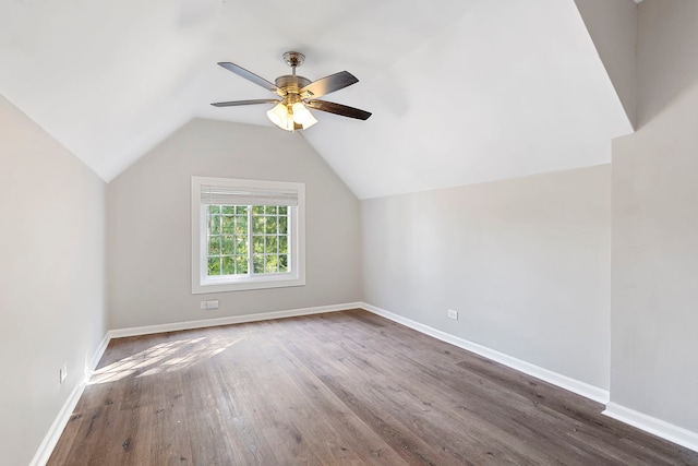 bonus room with ceiling fan, lofted ceiling, and dark hardwood / wood-style flooring