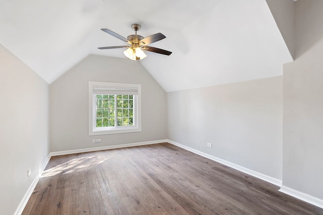 9208 S Dobson Ave, Chicago, IL 60619 - additional living space featuring vaulted ceiling, ceiling fan, baseboards, and wood finished floors