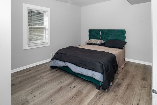 bedroom featuring hardwood / wood-style flooring