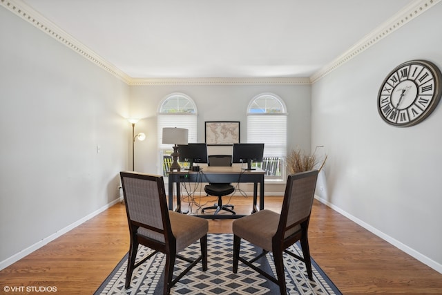 dining area with ornamental molding and hardwood / wood-style floors